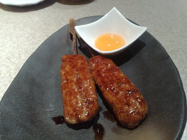 月見 Chicken Tsukune with Egg Yolk.