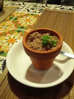 Basil foam, tomato, black olives sand and shiso