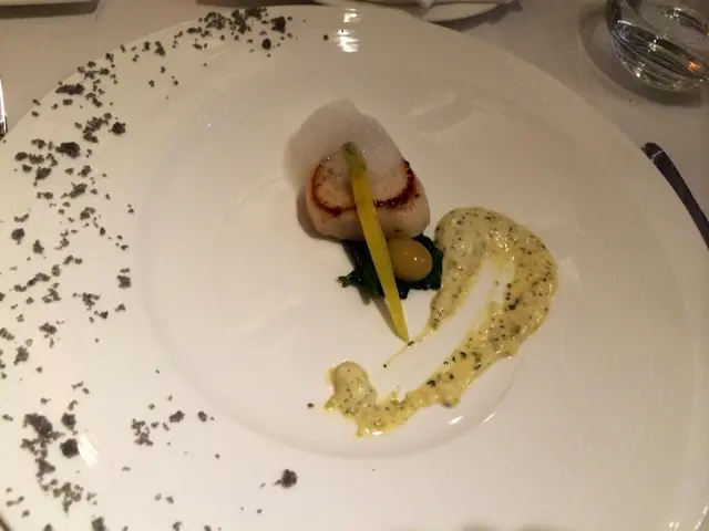 Roasted scallop with saffron rock fish essence