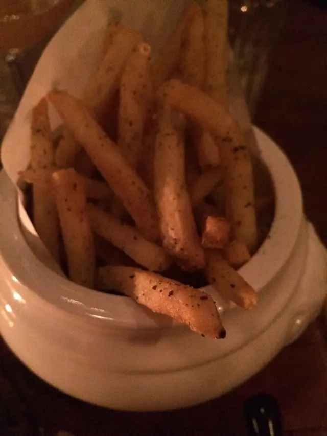 Fries coated with salt and pepper
