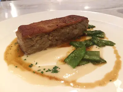 Slow Cooked Suckling Pig Terrine with Potato Foam and Seasonal Vegetables