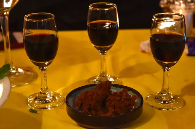 A glass of Spanish sherry and white chocolate & saffron rocks