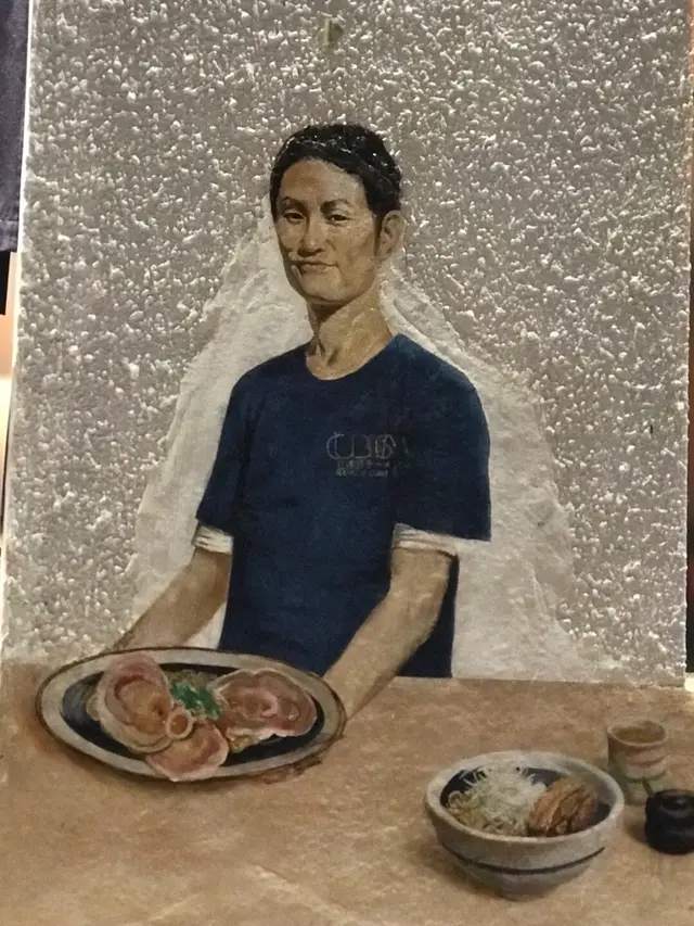 其中一幅畫正是來自大阪嘅拉麵大師林隆臣,即係創辦人老細是也
