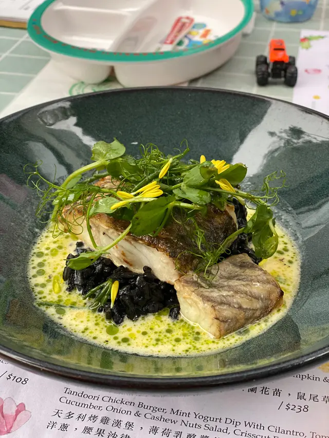 Barramundi  with  squid  ink  risotto