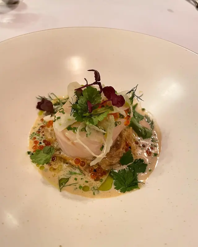Slow cooked cod fish, fennel and onion confit, salmon roe, beurre blanc sauce 