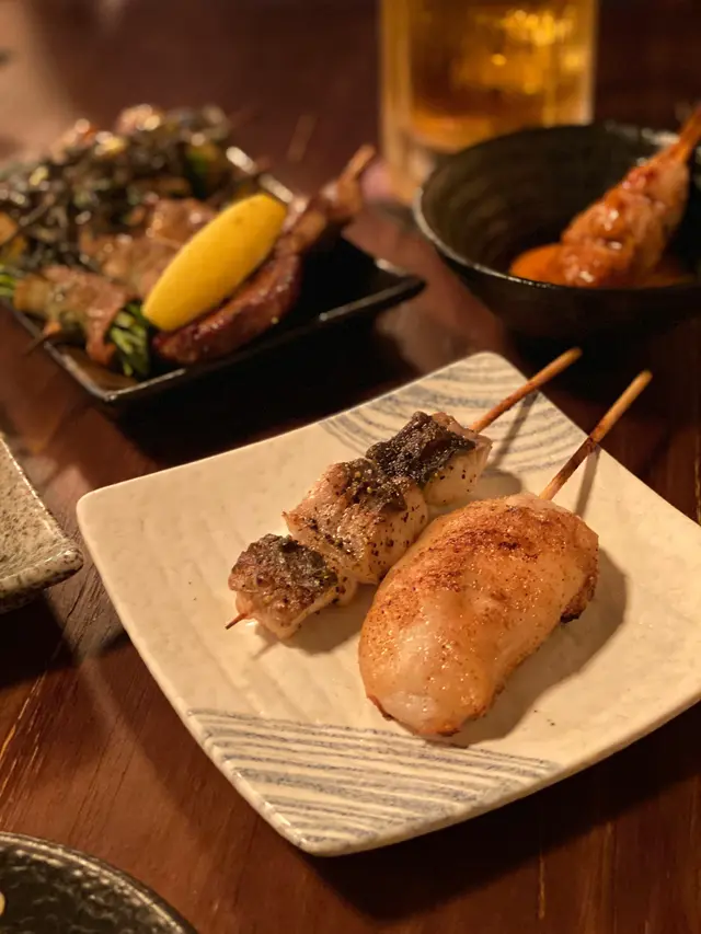 鹽燒白鱔 $48，雞皮墨魚滑 $38