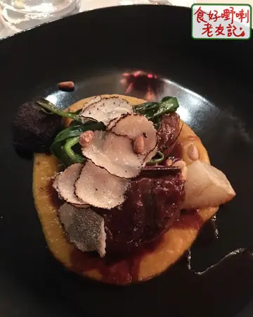 Slow  cooked  pork  cheek,  butternut  puree,  black  truffle  jus