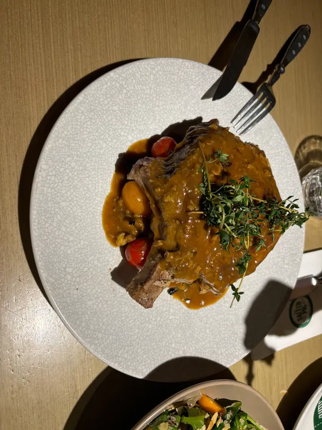 The pork chops were a wonderful surprise; they were thick and cooked perfectly. The combination of the fatty and lean meat was just right, and the sauce complemented it beautifully. We even asked for extra sauce. I highly recommend this dish!