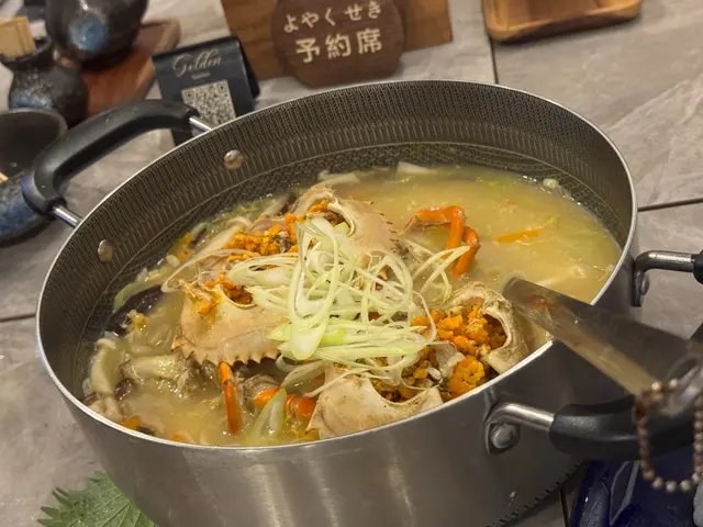 米粒吸滿蟹肉鮮味，湯底濃郁，暖笠笠咁好滿足。