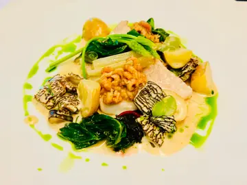 Braised aquna murray cod with morel ragout, swiss chard, brown shrimps, noirmoutier potatoes, broad beans and lovage oil