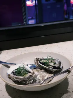 Oyster, pickled cucumber, horseradish, dill