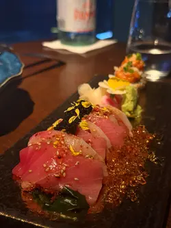 Tuna and yellowtail carpaccio with caviar and seaweed salad